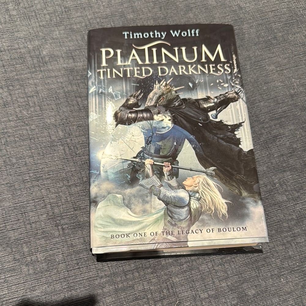 Signed fantasy novel with hardcover and dust jacket. Platinum Tinted Darkness
